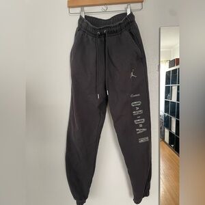 Youth dark gray Nike sweats.
